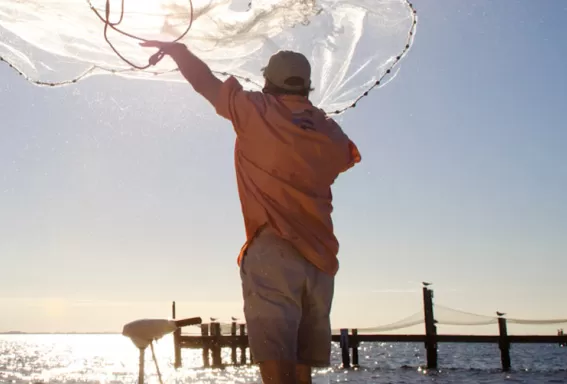 man fishing with a net